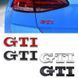 Емблема напис GTI для Volkswagen біла з сріблястою окантовкою 79х23 мм метал (на скотчі) 95646 фото 2