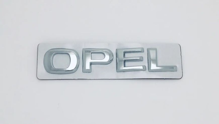 Емблема-напис Opel 112x20 мм Хромований пластик на стрічці (заводська) 88591 фото